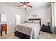 Bright bedroom features soft carpet, natural light, and modern furnishings at 4516 Savannah Holly Pl, Riverview, FL 33578