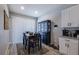 Eat-in dining area boasts natural light, wooden floors, and modern decor at 4516 Savannah Holly Pl, Riverview, FL 33578