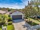 Charming single-Gathering home with a two-car garage, driveway, and well-maintained landscaping at 4516 Savannah Holly Pl, Riverview, FL 33578