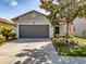 Charming single-Gathering home with a two-car garage and well-maintained landscaping at 4516 Savannah Holly Pl, Riverview, FL 33578