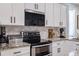 Kitchen featuring granite countertops, subway tile backsplash, and stainless appliances at 4516 Savannah Holly Pl, Riverview, FL 33578
