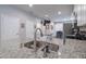 Bright kitchen with granite countertops, stainless steel appliances, and open floor plan at 4516 Savannah Holly Pl, Riverview, FL 33578