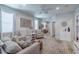 Bright and airy living room features neutral colors, modern decor, and natural light at 4516 Savannah Holly Pl, Riverview, FL 33578