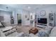 Spacious living room with open floor plan, neutral colors, and recessed lighting at 4516 Savannah Holly Pl, Riverview, FL 33578