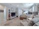 Bright living room features open floor plan, neutral colors, and modern decor at 4516 Savannah Holly Pl, Riverview, FL 33578