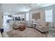 Cozy living room with open floor plan, natural light, and modern furnishings at 4516 Savannah Holly Pl, Riverview, FL 33578