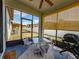 View of the screened patio with view of the backyard and white vinyl fence at 4516 Savannah Holly Pl, Riverview, FL 33578