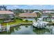 Aerial view of a waterfront home with a boat dock and pool at 4935 58Th S Ave, St Petersburg, FL 33715