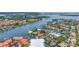 Aerial shot of canal-front house with private pool and boat dock in a charming coastal setting at 4935 58Th S Ave, St Petersburg, FL 33715