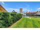 Lush backyard with green grass and canal views, creating a serene and private outdoor oasis at 4935 58Th S Ave, St Petersburg, FL 33715