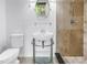 Bathroom featuring stylish sink, toilet, and updated shower at 4935 58Th S Ave, St Petersburg, FL 33715