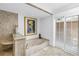 Bright bathroom with travertine floors featuring a jetted tub and shower at 4935 58Th S Ave, St Petersburg, FL 33715