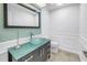 Contemporary bathroom with glass bowl sink, modern fixtures, and sleek tile accent wall at 4935 58Th S Ave, St Petersburg, FL 33715