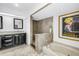 Spacious bathroom featuring double sinks, shower, jetted tub, and travertine floors at 4935 58Th S Ave, St Petersburg, FL 33715