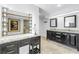 Bathroom featuring double sinks with granite countertops, makeup vanity, and walk-in shower at 4935 58Th S Ave, St Petersburg, FL 33715