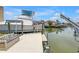 Private boat dock equipped with a lift, perfect for waterfront living and boating adventures at 4935 58Th S Ave, St Petersburg, FL 33715