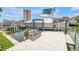 Private boat dock with lift and bench, ideal for boating enthusiasts and waterfront relaxation at 4935 58Th S Ave, St Petersburg, FL 33715