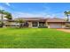 Charming single-story home featuring a well-manicured lawn and a classic tile roof at 4935 58Th S Ave, St Petersburg, FL 33715