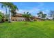 Well-maintained property with lush landscaping and a tile roof at 4935 58Th S Ave, St Petersburg, FL 33715