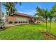 Attractive home with lush lawn and manicured landscaping at 4935 58Th S Ave, St Petersburg, FL 33715