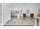 Bright foyer featuring tile floors, white walls, and an open floor plan leading to the living area and kitchen at 4935 58Th S Ave, St Petersburg, FL 33715