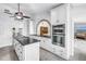 Modern kitchen featuring white cabinetry, granite counters, and stainless steel appliances at 4935 58Th S Ave, St Petersburg, FL 33715