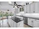 Well-lit kitchen with stainless steel appliances, granite countertops, and view to the outside at 4935 58Th S Ave, St Petersburg, FL 33715