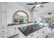 Gourmet kitchen with granite counters, custom cabinets, and a seamless connection to the outdoors at 4935 58Th S Ave, St Petersburg, FL 33715
