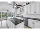 Bright kitchen with modern appliances, granite countertops, and a view of the water at 4935 58Th S Ave, St Petersburg, FL 33715