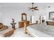 Spacious main bedroom featuring travertine floors, high ceilings, and decorative wood furniture at 4935 58Th S Ave, St Petersburg, FL 33715