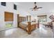 Spacious bedroom with high ceilings, tile flooring, large windows, and outdoor access at 4935 58Th S Ave, St Petersburg, FL 33715