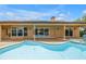 Backyard pool with inviting patio area and view of sliding glass doors to home at 4935 58Th S Ave, St Petersburg, FL 33715