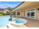 Backyard area with covered patio, swimming pool and jacuzzi at 4935 58Th S Ave, St Petersburg, FL 33715