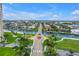 Gated community with waterfront homes, lush landscaping and picturesque bridge over the canal in Florida at 4935 58Th S Ave, St Petersburg, FL 33715