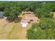 Aerial view of a home among mature shade trees at 5306 Downing St, Dover, FL 33527