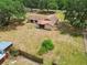 Aerial view of the home set amid mature trees at 5306 Downing St, Dover, FL 33527