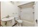 A well-lit bathroom with a pedestal sink, standard toilet, and a shower-tub combination at 5306 Downing St, Dover, FL 33527