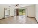 Bedroom with sliding glass door and a view to the backyard with a water feature at 5306 Downing St, Dover, FL 33527