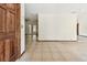 Spacious living room with tiled flooring and seamless flow to additional living spaces at 5306 Downing St, Dover, FL 33527