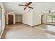 Expansive living room with tiled floors and neutral walls, ready for personalized decor at 5306 Downing St, Dover, FL 33527