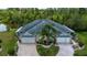 Aerial view of home highlighting its landscaping, symmetrical design, and lush surroundings at 542 Princeton Greens Ct # 21, Sun City Center, FL 33573