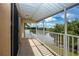 Private balcony with a scenic lake view for relaxation and outdoor enjoyment at 542 Princeton Greens Ct # 21, Sun City Center, FL 33573