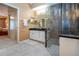 A stylish bathroom features an elegant glass shower, vanity, and access to the bedroom at 542 Princeton Greens Ct # 21, Sun City Center, FL 33573