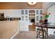 Kitchen breakfast bar with built-in wine rack and stainless steel appliances at 542 Princeton Greens Ct # 21, Sun City Center, FL 33573