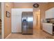 Kitchen featuring stainless steel refrigerator with in-door ice and water dispenser and white cabinets at 542 Princeton Greens Ct # 21, Sun City Center, FL 33573