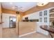 Bright eat-in kitchen with stainless steel appliances, granite countertops, and white cabinets at 542 Princeton Greens Ct # 21, Sun City Center, FL 33573