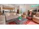 Cozy living room with comfortable seating, a patterned rug, and natural light at 542 Princeton Greens Ct # 21, Sun City Center, FL 33573
