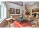 Open-plan living area with tile flooring, large window, and natural light at 542 Princeton Greens Ct # 21, Sun City Center, FL 33573