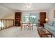 Bright and airy living room featuring a sitting area and balcony overlooking lush greenery at 542 Princeton Greens Ct # 21, Sun City Center, FL 33573