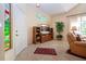 This living room boasts tile floors, large window, and decorative stained-glass at 542 Princeton Greens Ct # 21, Sun City Center, FL 33573